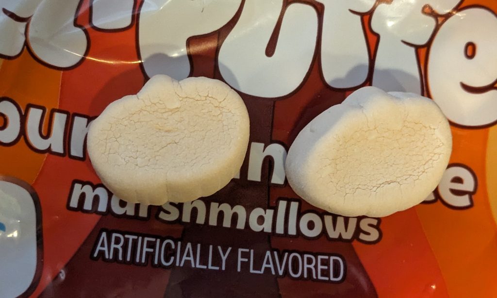 Close up of two Jet-puffed pumpkin spice marshamallows