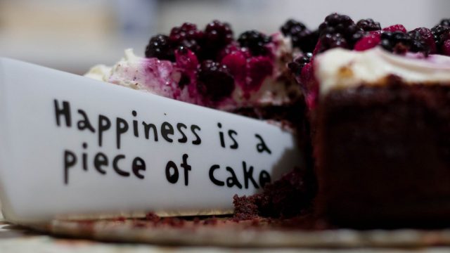 happiness is a piece of cake close up photography