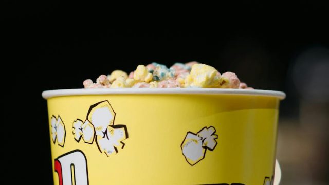 bucket of popcorn in close up photography